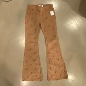 Free People bell bottom corduroy pants with embroidery. NWT
